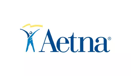 The image features a logo with a stylized depiction of a person in a blue silhouette holding an umbrella, set against a light background, with the text AETNA prominently displayed.